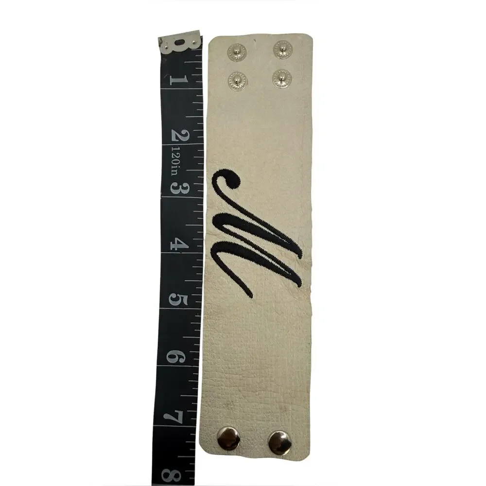 Monogram 'M' Wide Snap Cuff Bracelet in Cream with Black Lettering